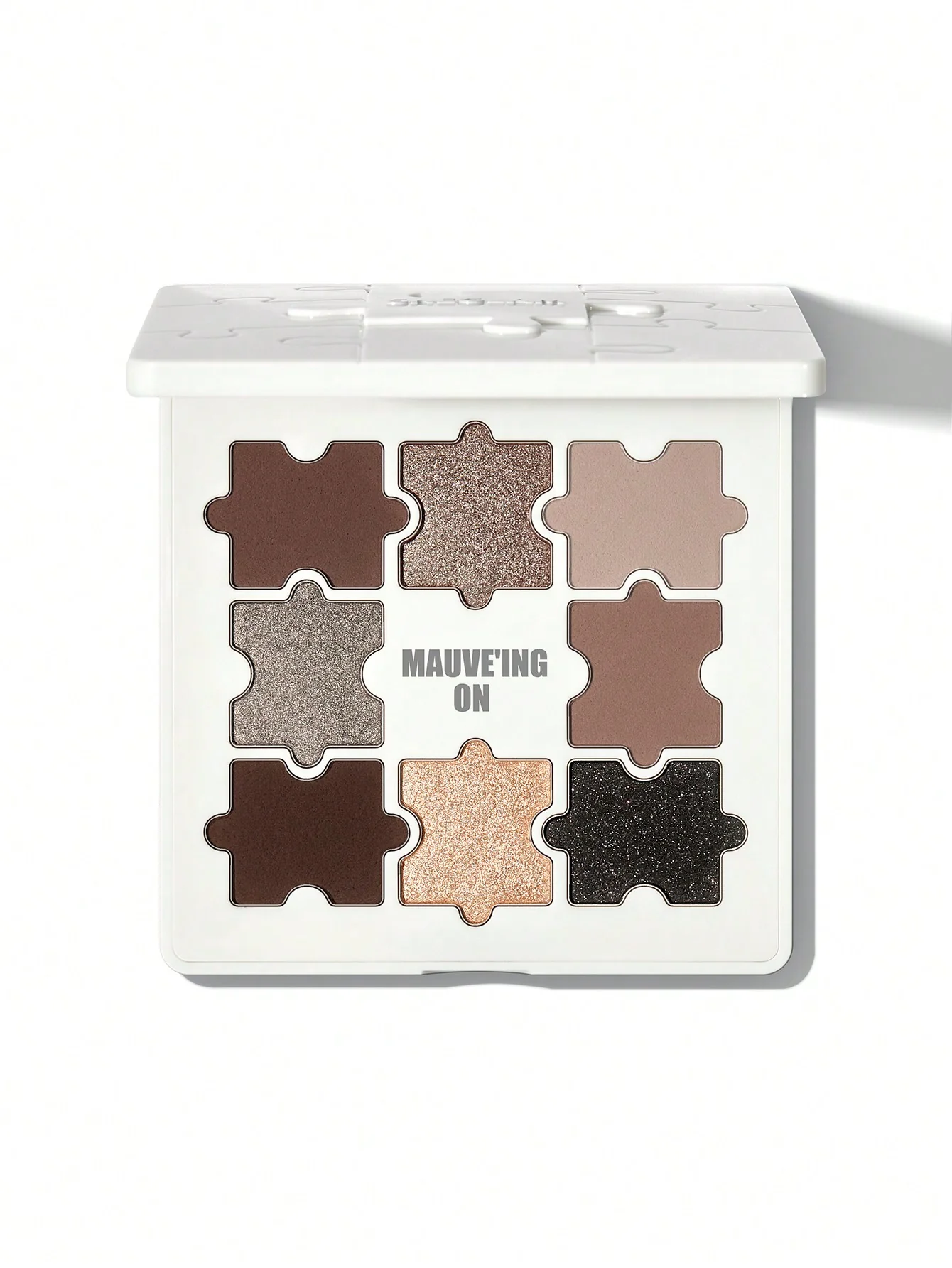 sheglam-JAZY-JIGSAW-EYESHADOW-PALETTE-MAUVEING-ON پالت سایه چشم طرح پازلی شیگلم مدل Mauve'ing on - تصویر 1